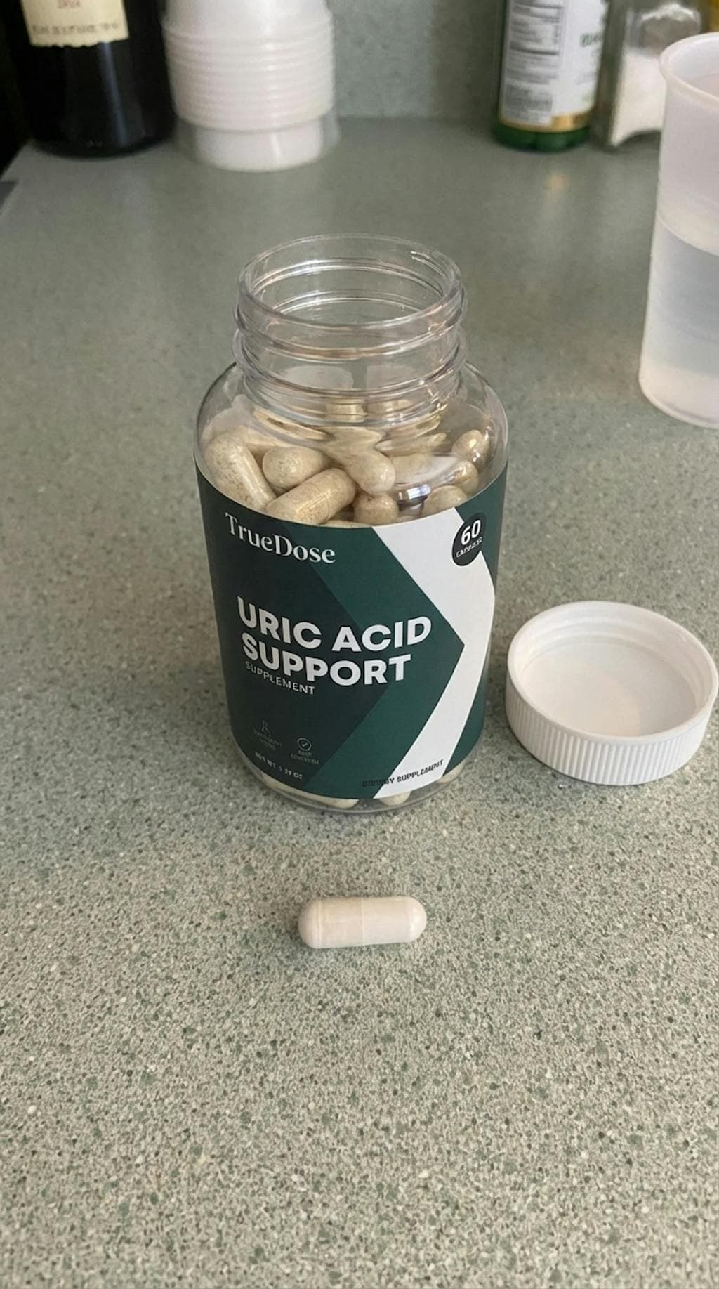 Customer-submitted TrueDose bottle photo on a countertop